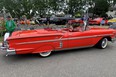 The Rio Red 1958 Chevrolet Impala — just one of many, many sweet collector and classic cars at the show —  has all the extras.