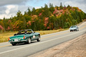 Matt Bartlett in his 1973 MGB, and Hilary Riem in her father Justin's 1966 Ford Mustang