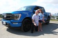 Tester Ted Pietryka and his daughter Ava are seen with the 2021 Ford F-150.